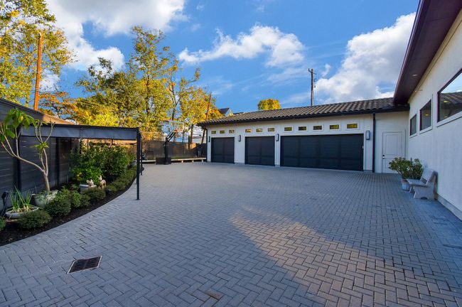 4 car oversized garages - plus herringbone paved driveway and extra parking. | Image 49