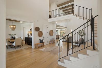 Gorgeous modern farmhouse design with 22' ceilings with natural beams and wide-plank white oak flooring. | Image 3