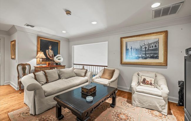 Living room featuring ornamental molding, recessed lighting, baseboards, and wood finished floors | Image 29