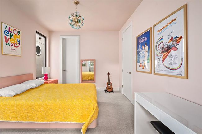 This alternate view highlights the room’s thoughtful balance of fun and function—featuring soft blush walls, plush carpeting and a nicely-sized walk-in closet. | Image 25
