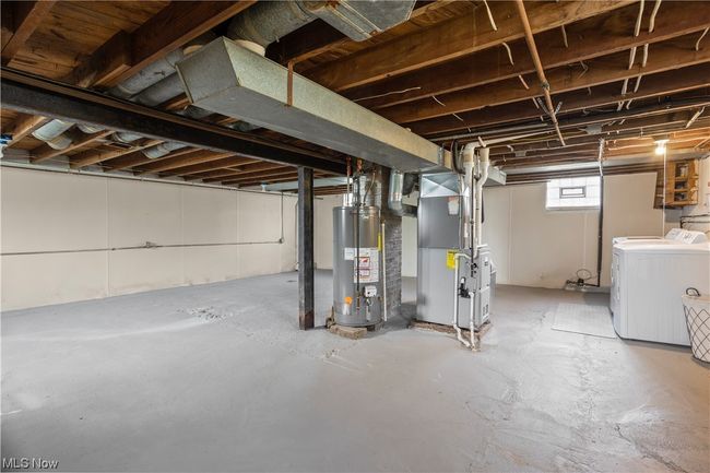 Basement featuring independent washer and dryer and gas water heater | Image 28