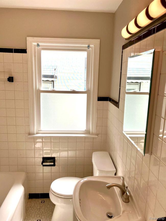 Bathroom w/new LED light fixture, new toilet, new ceiling fan and fresh paint. | Image 12