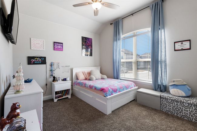Bedroom featuring lofted ceiling, carpet, and a ceiling fan | Image 4