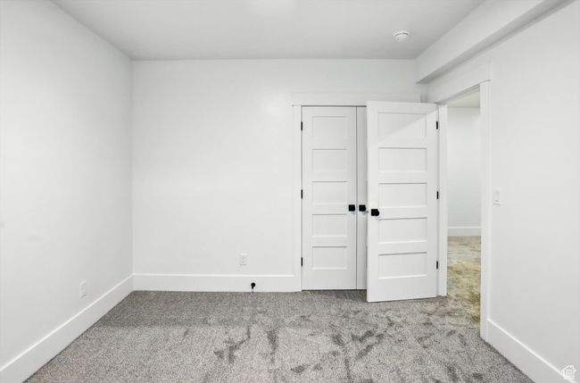 Unfurnished bedroom with carpet | Image 43