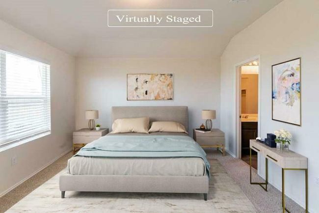 Carpeted bedroom featuring vaulted ceiling and ensuite bathroom | Image 8