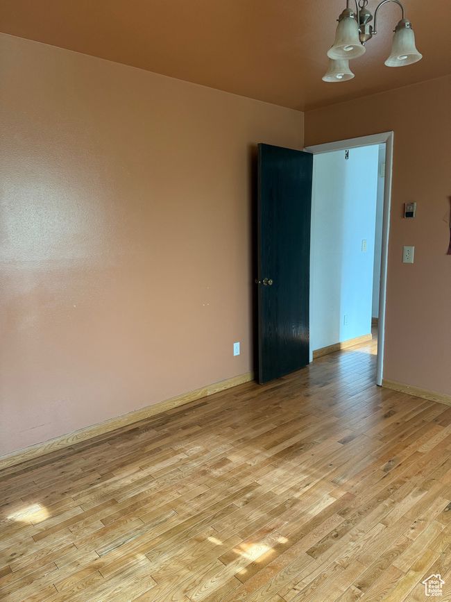 Unfurnished room with baseboards and light wood-style floors | Image 18