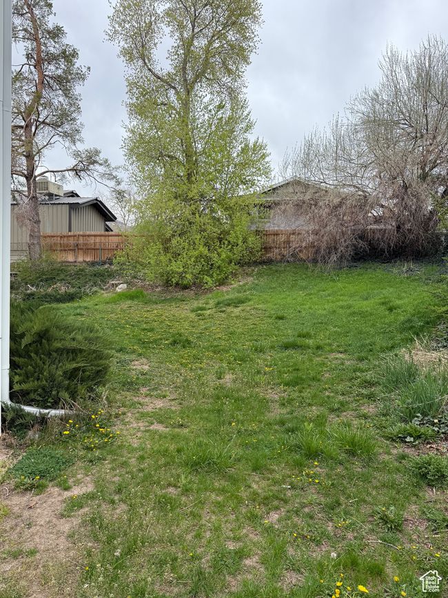 View of yard featuring fence | Image 23