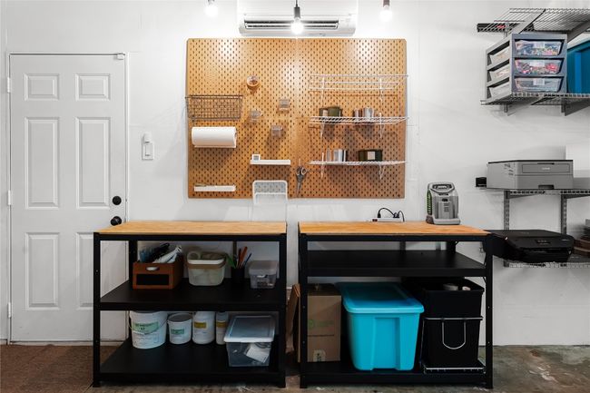 Detailed view of a HVAC Mini-Split Unit above work station in garage | Image 28