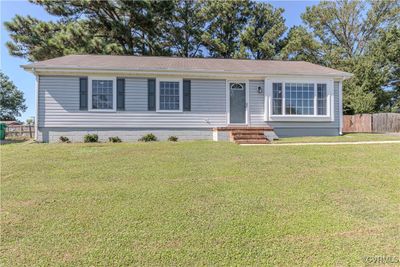 View of front of house featuring a front lawn | Image 1