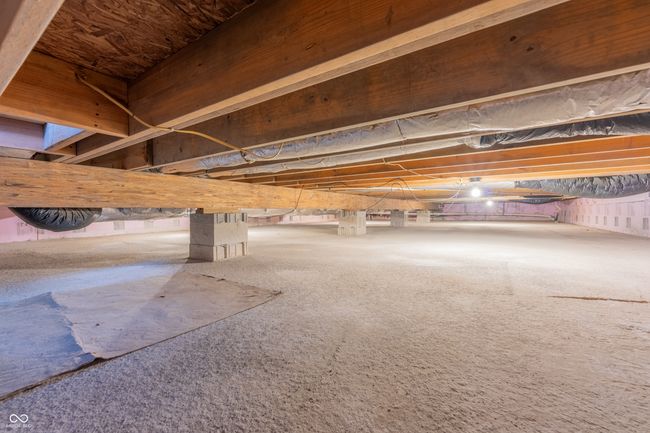 View of crawl space with concrete floor | Image 23