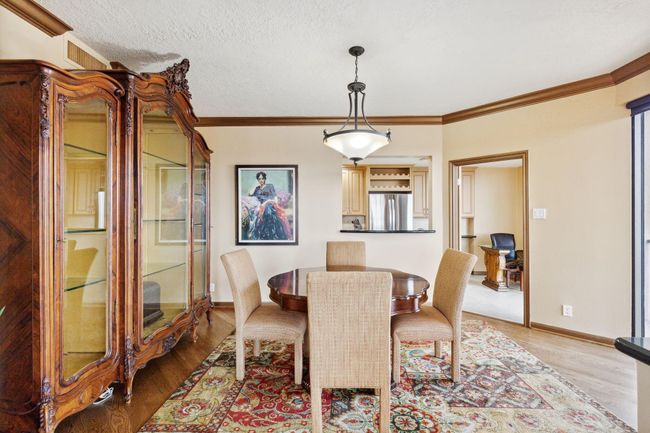 Secondary view to the dining room with access to adjacent rooms is easy through two open doorways. | Image 10