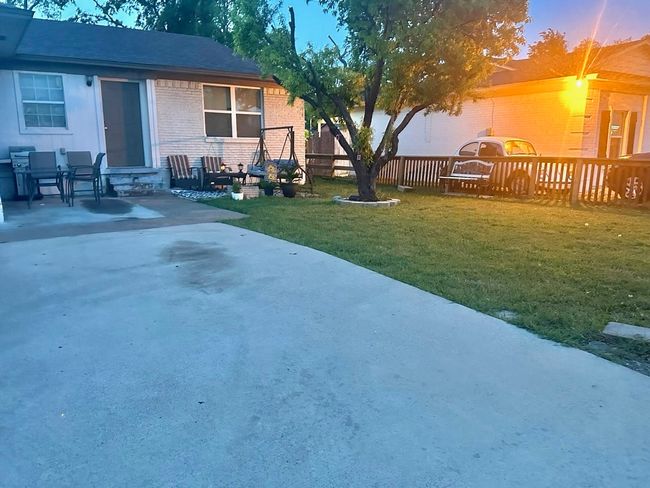 View of yard with a patio and fence | Image 7