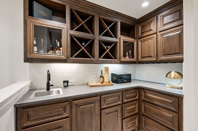 Indoor bar featuring backsplash | Image 24