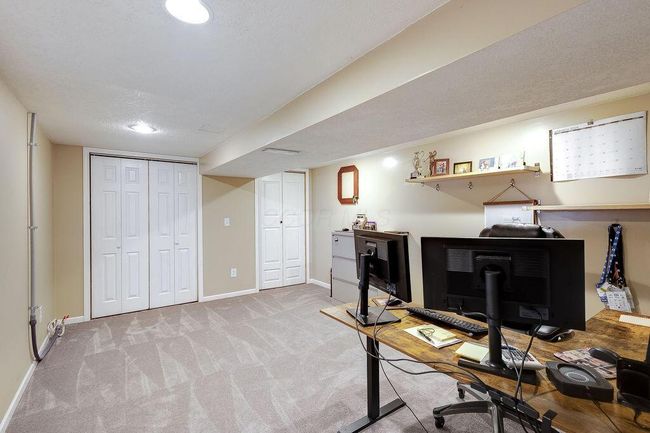 Bedroom 5/office in lower level with large window and access to walkout. | Image 41