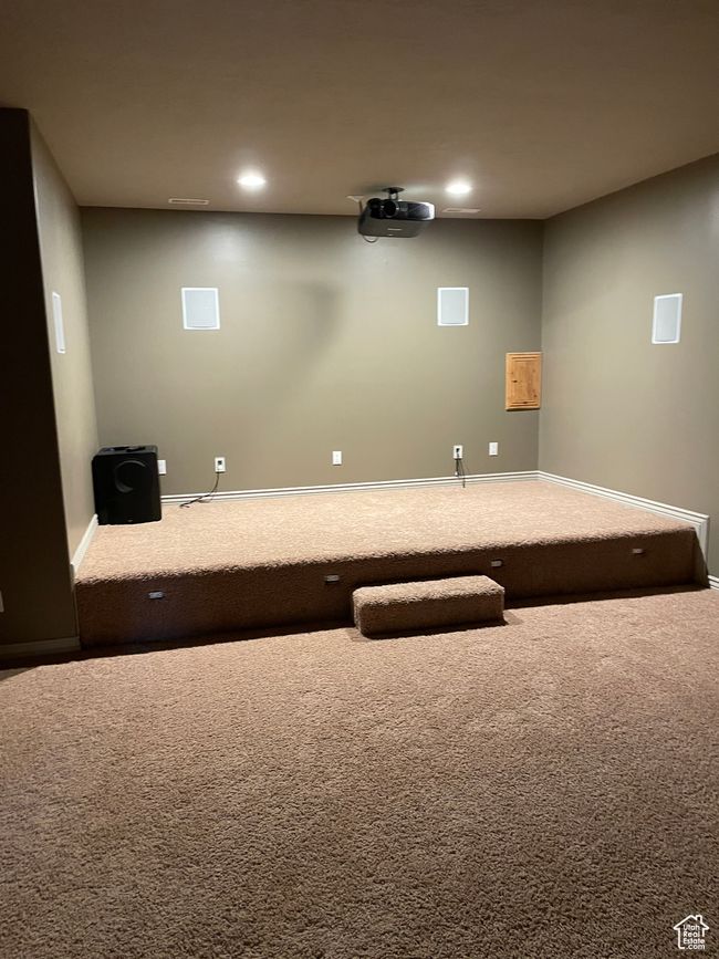 Cinema room with carpet flooring and recessed lighting | Image 17