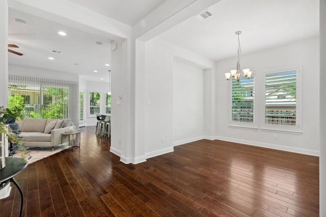 The formal dining room is tucked just behind the kitchen for easy serving accessibility. | Image 5
