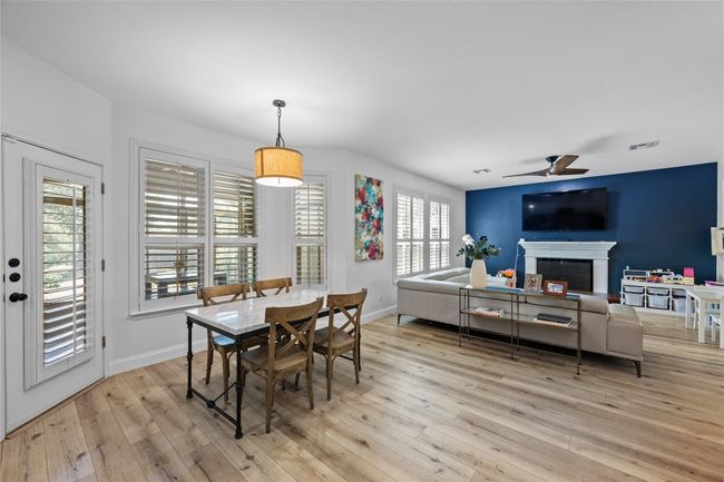 You'll love having the kitchen and breakfast area open to the family room | Image 4