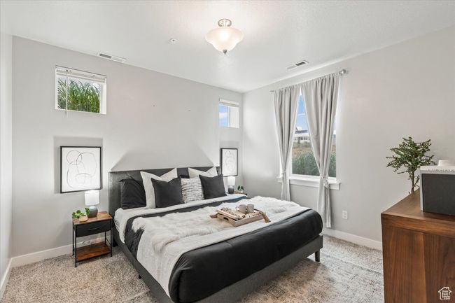 Bedroom featuring carpet floors and multiple windows | Image 5