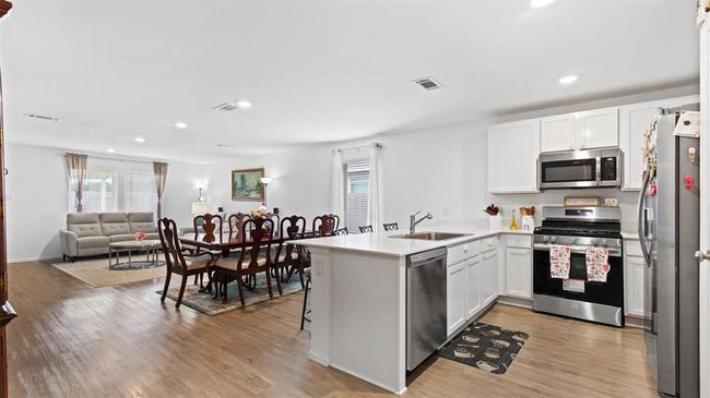 open concept with spacious kitchen and living area | Image 4