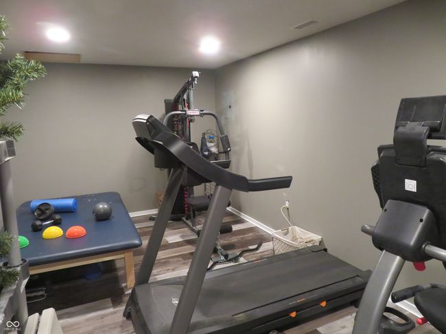 Exercise room with luxury vinyl plank flooring. Weight machine is negotiable. | Image 24
