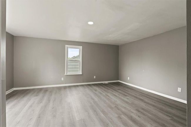 Empty room featuring wood finished floors and baseboards | Image 19
