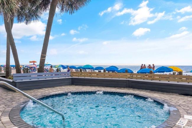 View of pool with a community hot tub | Image 37