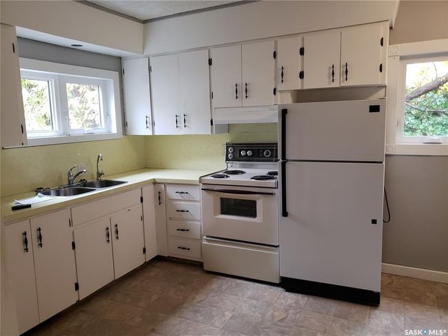 Bright sunny eat-in kitchen has lots of natural light and updated windows. | Image 4