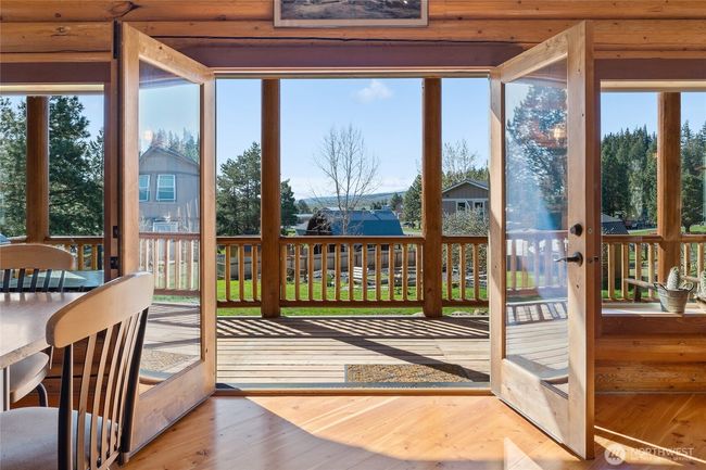 Paradise! The main part of the house - set in a greatroom style where living, dining and kitchen areas are centrally located and have the focus on this amazing view. | Image 9