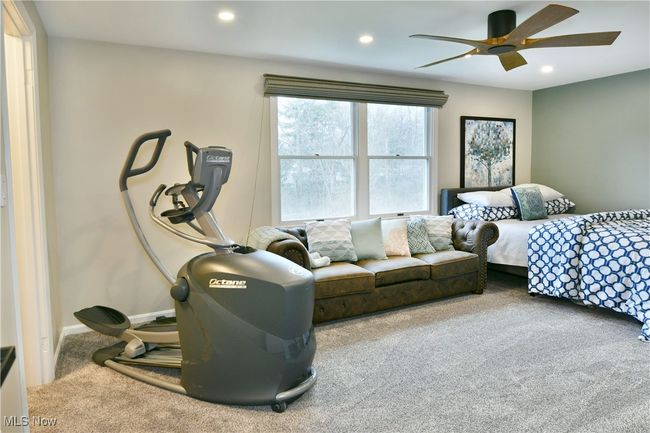 Bedroom featuring carpet flooring, baseboards, a ceiling fan, and recessed lighting | Image 37