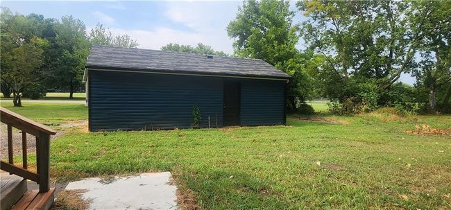 View of outbuilding with a lawn | Image 6