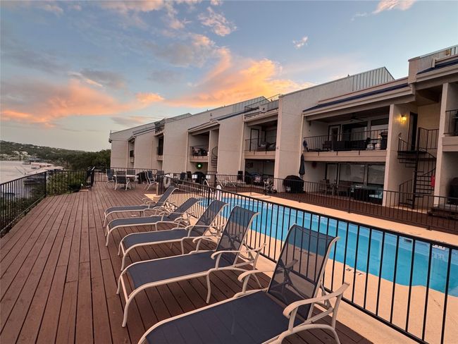 Pool at dusk featuring a community pool | Image 27