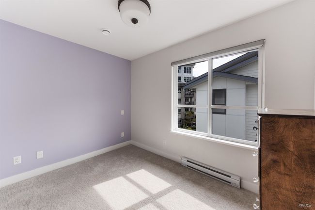 Unfurnished room with baseboard heating, carpet floors, and baseboards | Image 27
