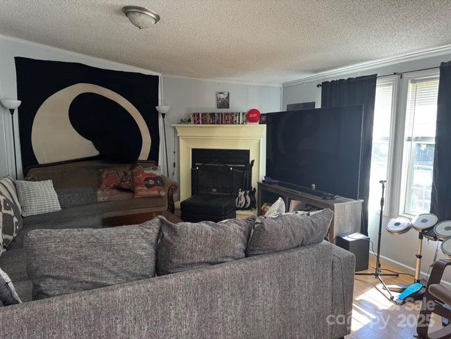 back living area w/ fire place | Image 12