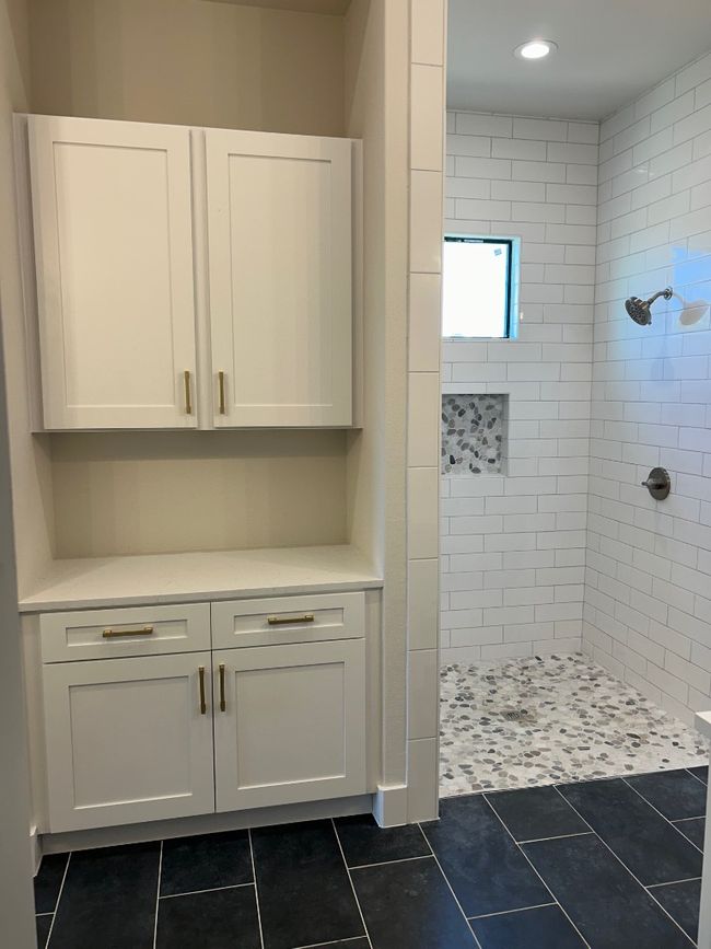 Bathroom with tiled shower, tile patterned floors, and recessed lighting | Image 17