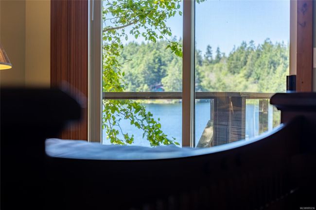 Primary bedroom with lake view | Image 20