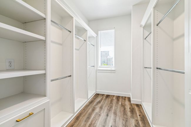Spacious closet featuring wood finished floors | Image 22