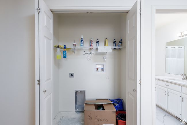 Laundry room with electric dryer hookup and hookup for a washing machine | Image 13