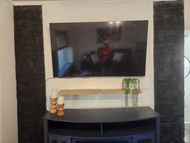 Stacked black rock and shiplap TV wall | Image 4