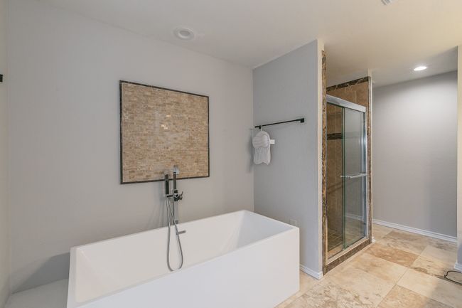Unit 4904 View of Primary Bathroom featuring separate shower and tub | Image 34