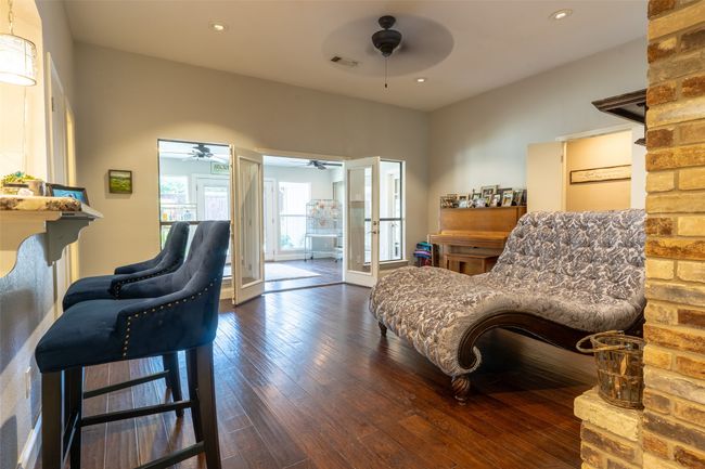 Sitting room featuring a ceiling fan, wood-type flooring, and recessed lighting | Image 6