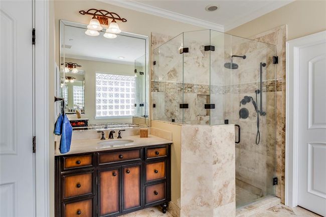 Huge Primary Bathroom with separate vanities, seamless glass shower, large glass mirrors | Image 25
