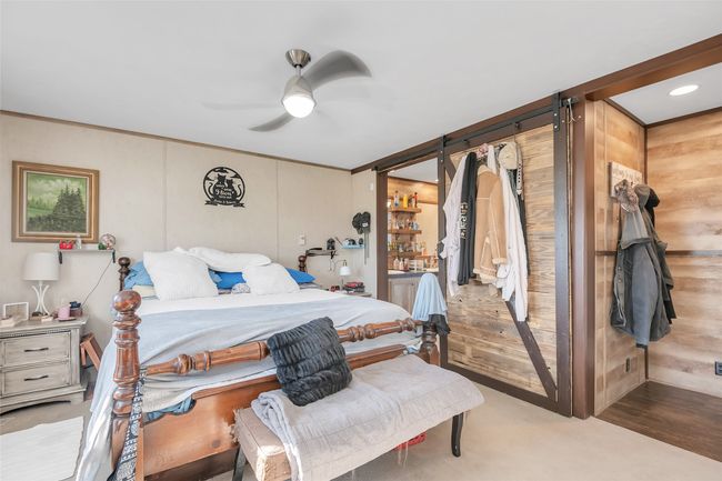 Bedroom with crown molding and a ceiling fan | Image 25