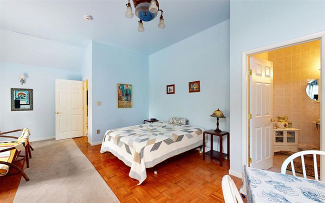 Bedroom with baseboards and a chandelier | Image 30