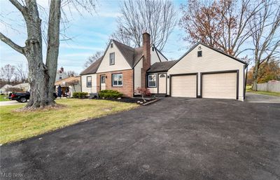 View of front of property featuring a garage and a front yard | Image 2