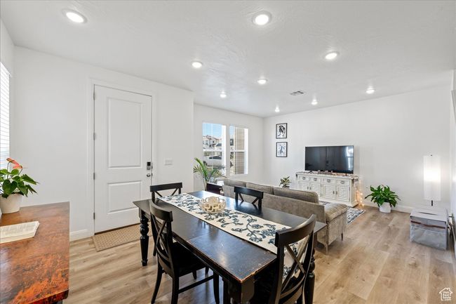 Dining room featuring light wood-style floors and recessed lighting | Image 13