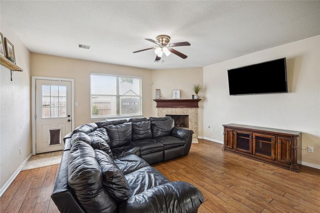 Cozy family room with fireplace! | Image 10