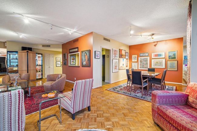 The living area seamlessly flows into the dining room, conveniently located just off the kitchen. | Image 5