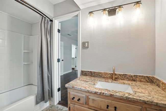 Full bath with vanity and shower / bathtub combination with curtain | Image 19