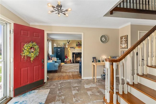 Foyer with crown molding and plenty of natural light | Image 6