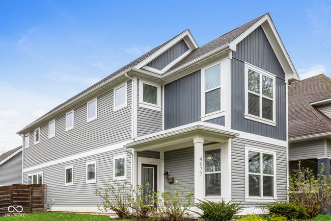 craftsman inspired home with board and batten siding, a shingled roof, and fence | Image 20